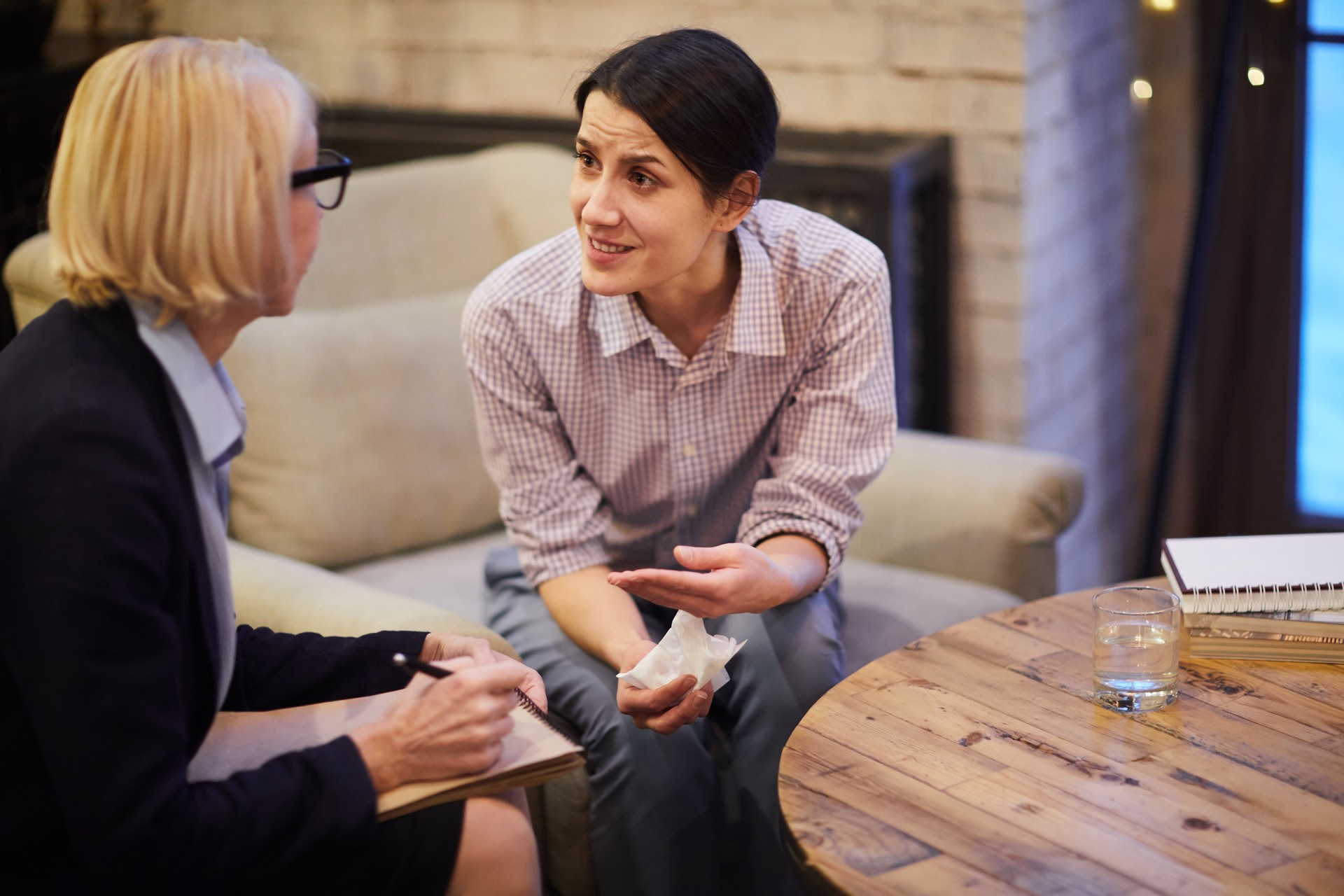 Troubled Woman Talking to Psychologist